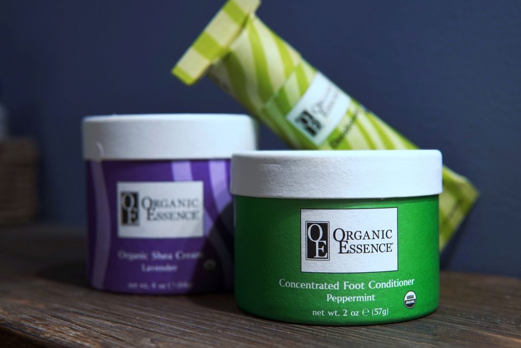 Organic Essence certified organic shea cream lavender jar concentrated foot conditioner peppermint jar and eco tube compostable paper packaging collection